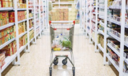 Abstract blur shopping cart in supermarket ,grocery store background.